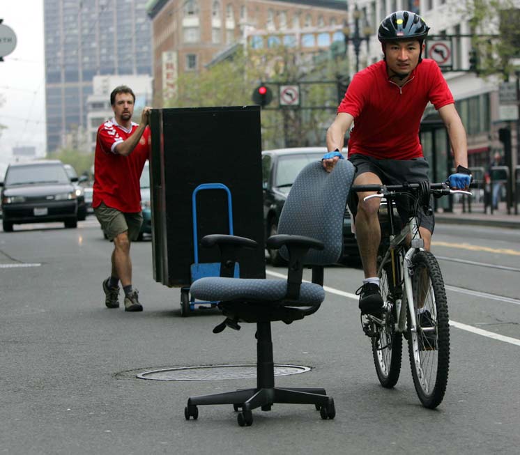 In more quaint times, fellow 10+ year member Matt Geis and I volunteered to roll office furniture from 1095 Market to 995 Market on March 12, 2005. (AP Photo/Marcio Jose Sanchez)